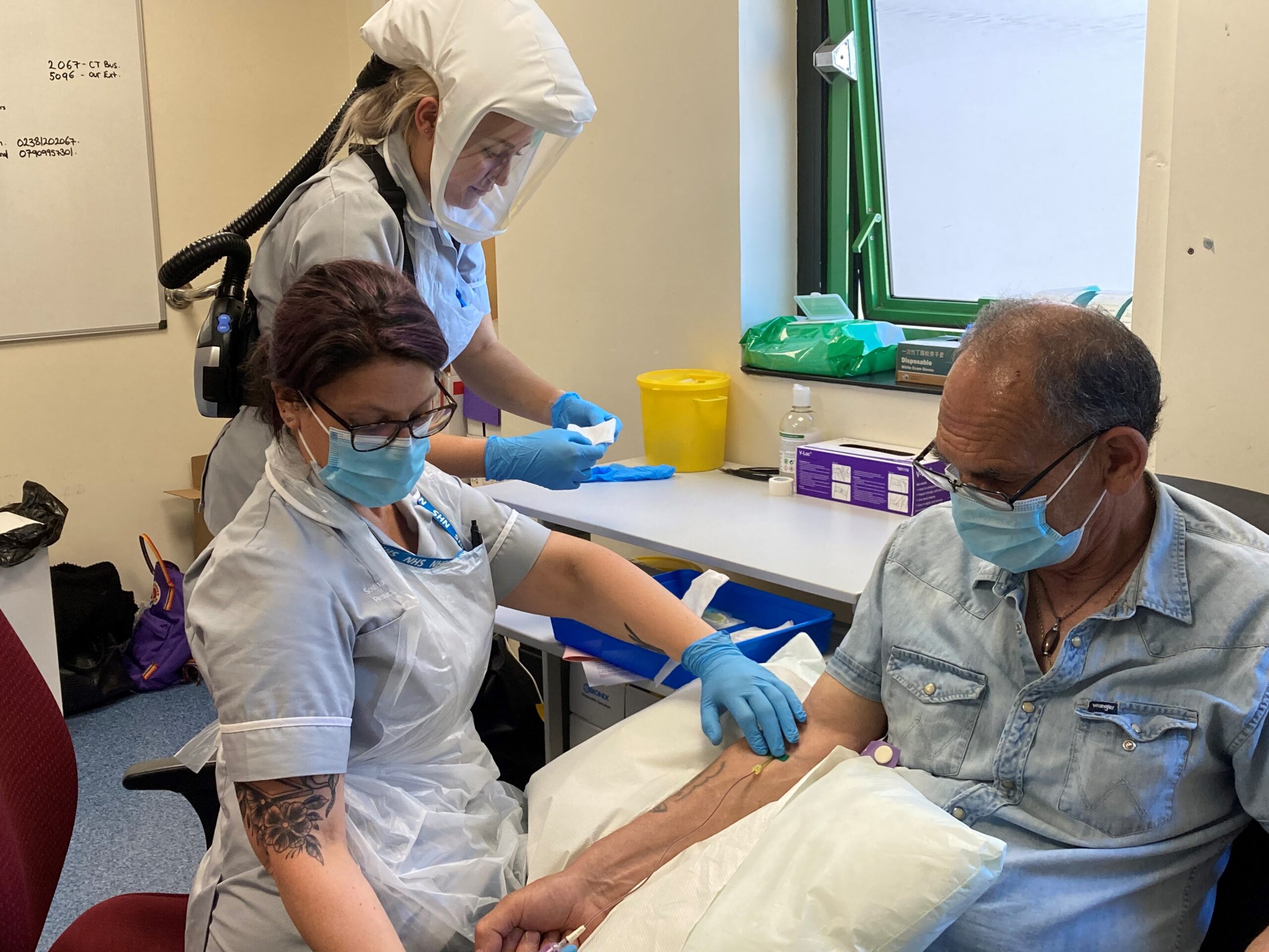 iDx Lung team taking blood sample from patient